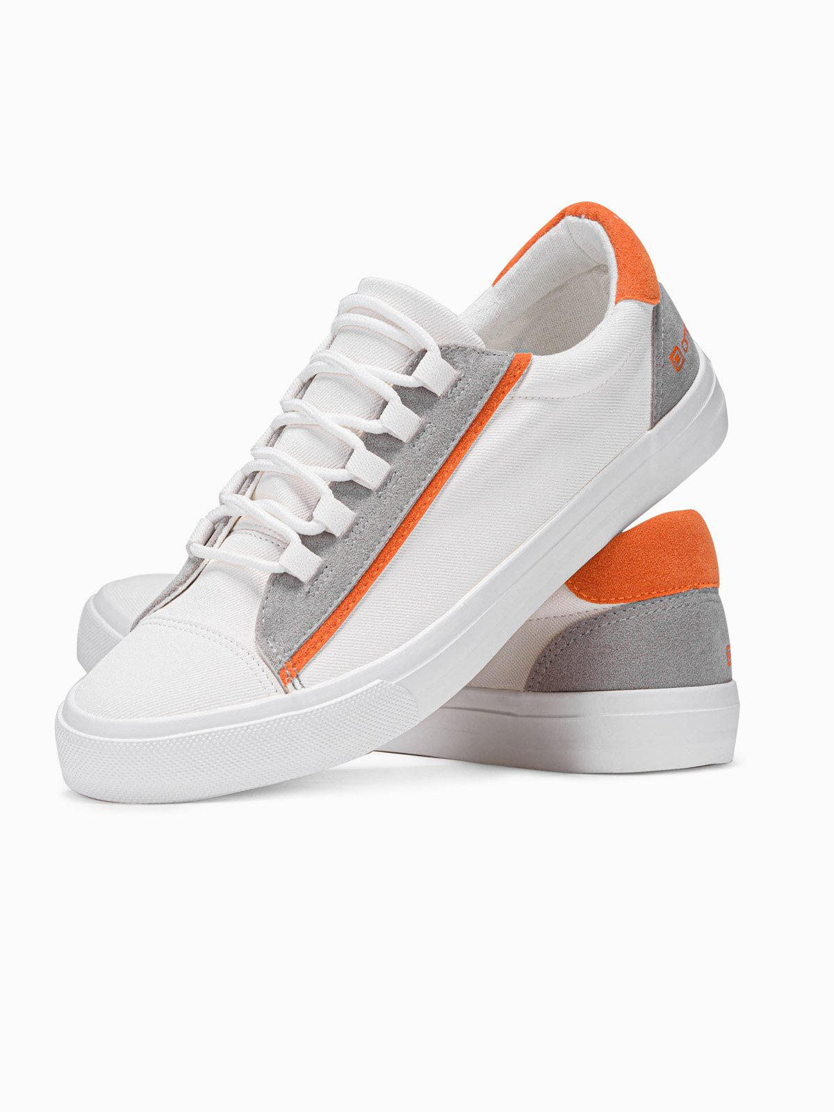 white and orange trainers