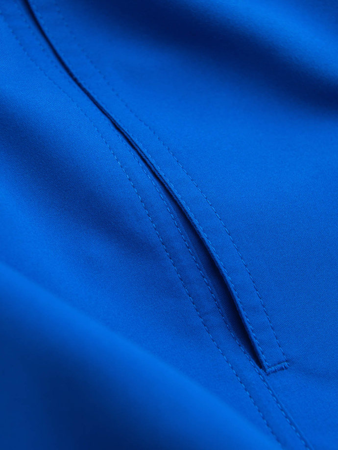 Neonowe męskie szorty kąpielowe z efektem magic print – niebieskie V3 OM-SRBS-0147