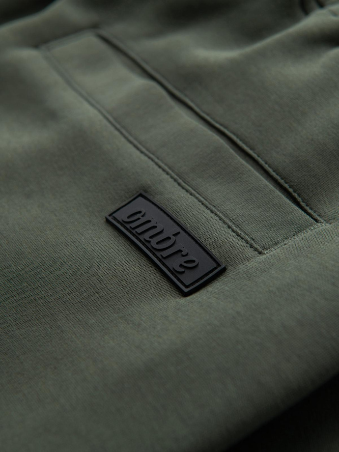 Spodnie męskie dresowe z prostą nogawką i gumowymi detalami – ciemnooliwkowe V4 OM-PASK-0281