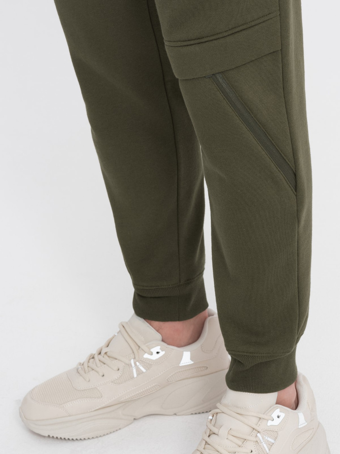 Men's sweatpants with stitching and leg zipper - olive V3 OM-PASK-0147