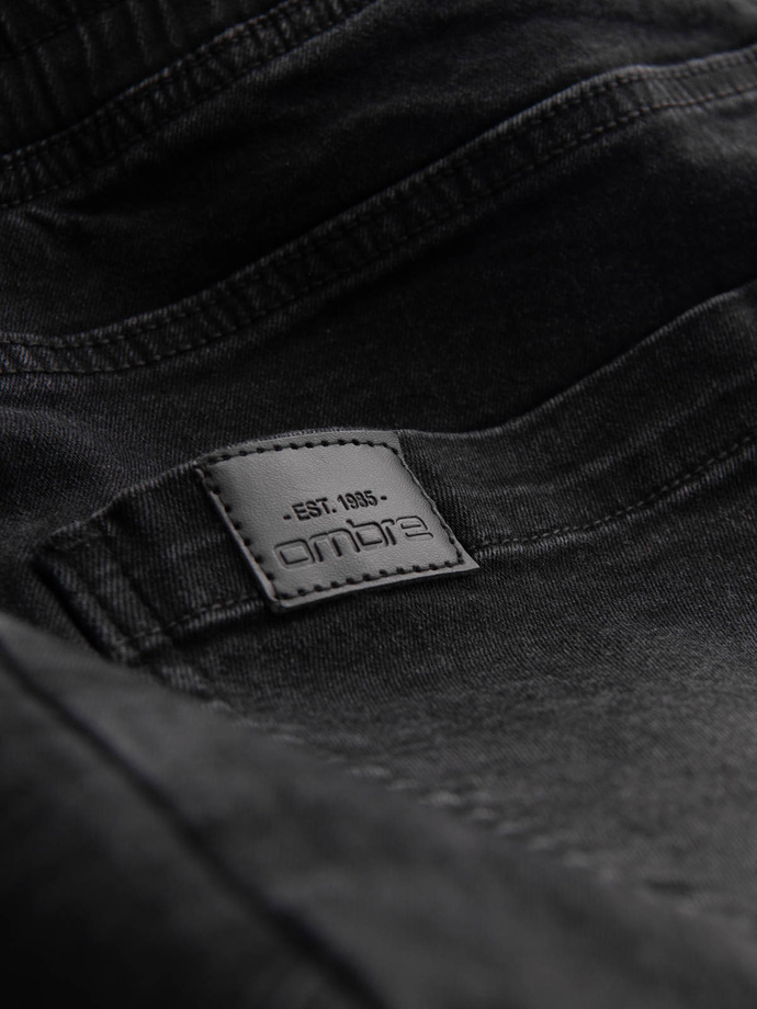 Męskie jeansowe joggery z asymetrycznymi przeszyciami – czarne V3 OM-PADJ-0165
