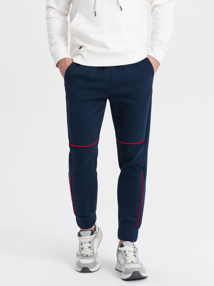 Spodnie męskie dresowe z kontrastowymi przeszyciami - granatowe V4 OM-PASK-0145