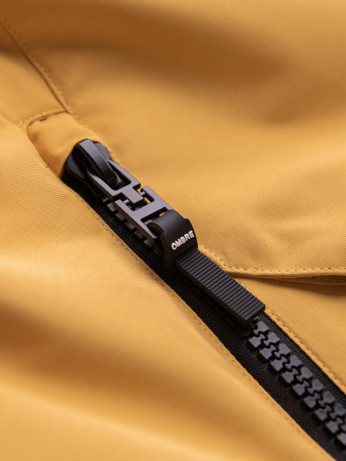 Długa ocieplana męska kurtka z odblaskowymi elementami – żółta V2 OM-JALJ-0169