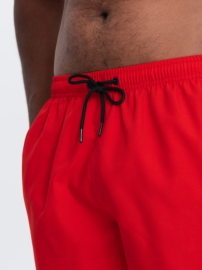 Neon men's swim shorts with magic print effect - red V5 OM-SRBS-0147