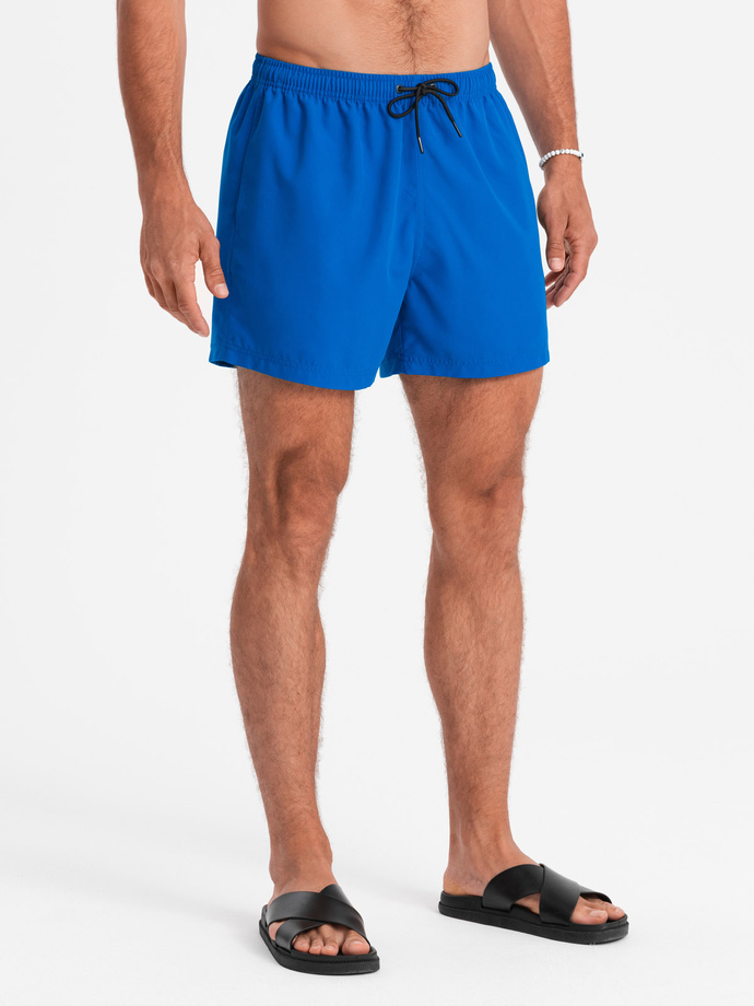 Neonowe męskie szorty kąpielowe z efektem magic print – niebieskie V3 OM-SRBS-0147