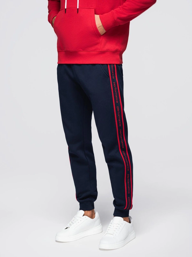 Sportowe spodnie męskie jogger z lampasami – granatowe V3 OM-PASK-0284