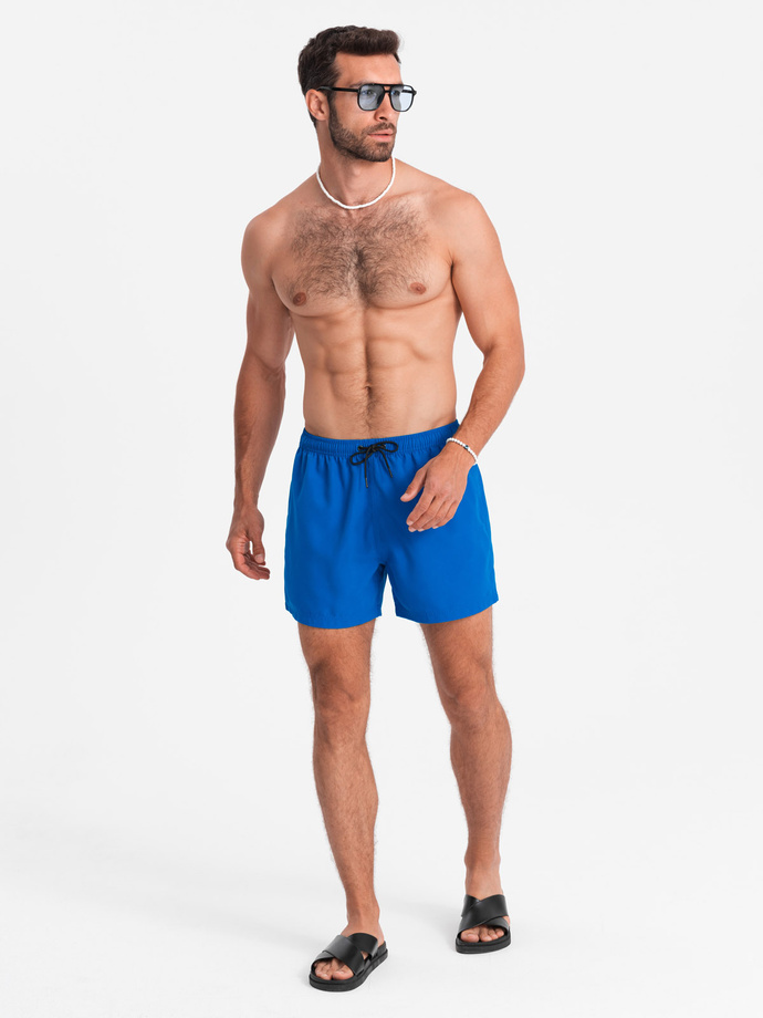 Neon men's swim shorts with magic print effect - blue V3 OM-SRBS-0147