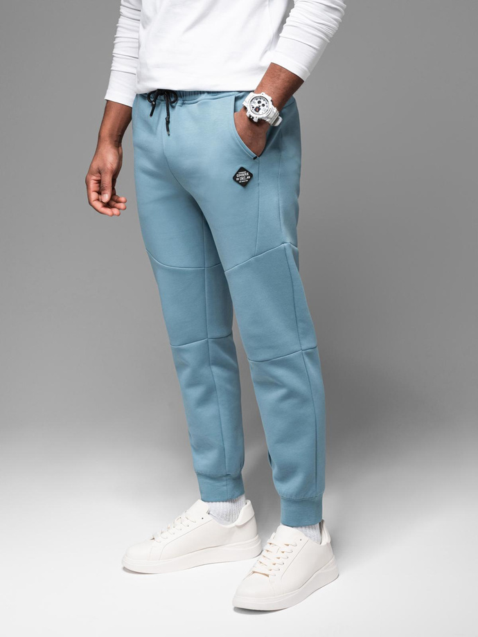 Men's sweatpants with ribbed cuffs and decorative zipper - light blue V4 OM-PASK-0226