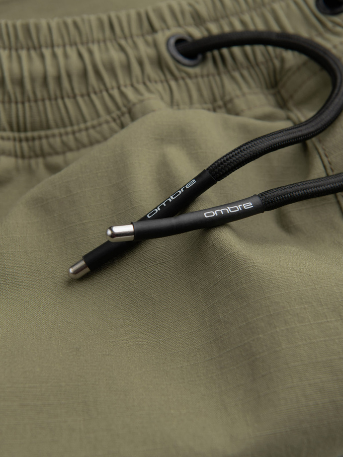 Męskie spodnie JOGGERY z zapinanymi kieszeniami cargo - jasnooliwkowe V1 OM-PAJO-0135