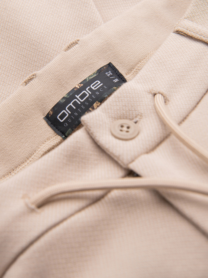 Spodnie męskie CARROT ze strukturalnej dwukolorowej dzianiny - beżowe V2 OM-PACP-0168