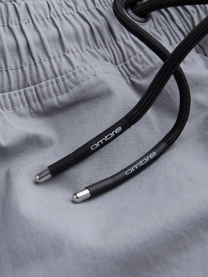 Spodnie męskie JOGGERY z odstającymi i zapinanymi kieszeniami cargo - jasnoszare V8 OM-PAJO-0135