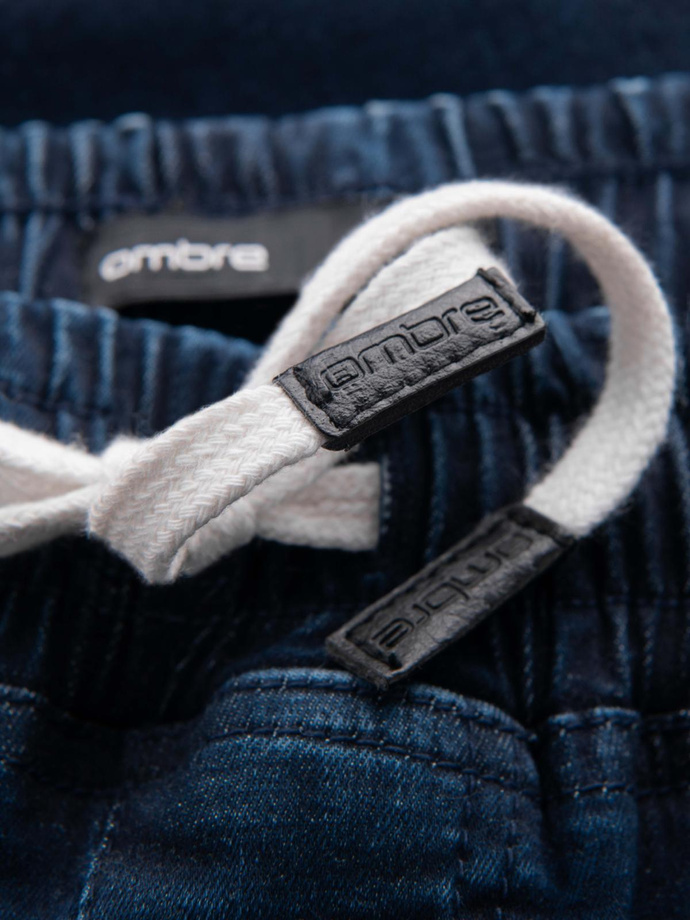 Męskie jeansowe joggery z lampasami – ciemnoniebieskie V4 OM-PADJ-0156