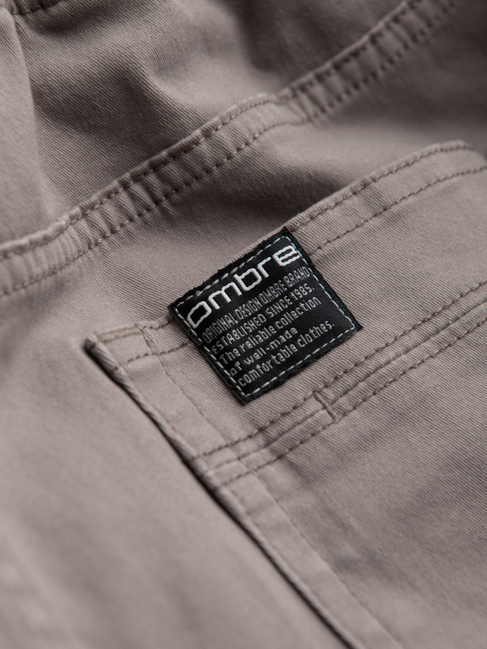 Męskie spodnie JOGGERY z zapinanymi kieszeniami cargo - ciemnobeżowe V2 OM-PAJO-0125