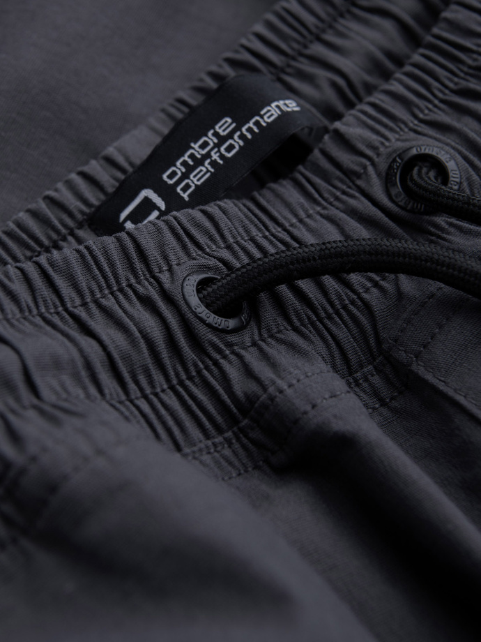 Męskie spodnie JOGGERY z odstającymi i zapinanymi kieszeniami cargo - grafitowe V6 OM-PAJO-0135