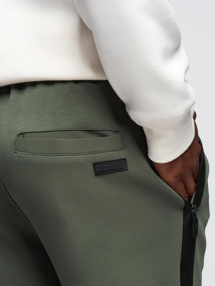 Spodnie męskie dresowe z prostą nogawką i gumowymi detalami – ciemnooliwkowe V4 OM-PASK-0281