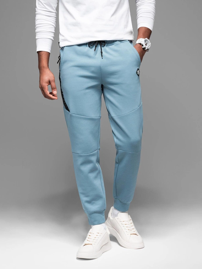 Men's sweatpants with ribbed cuffs and decorative zipper - light blue V4 OM-PASK-0226