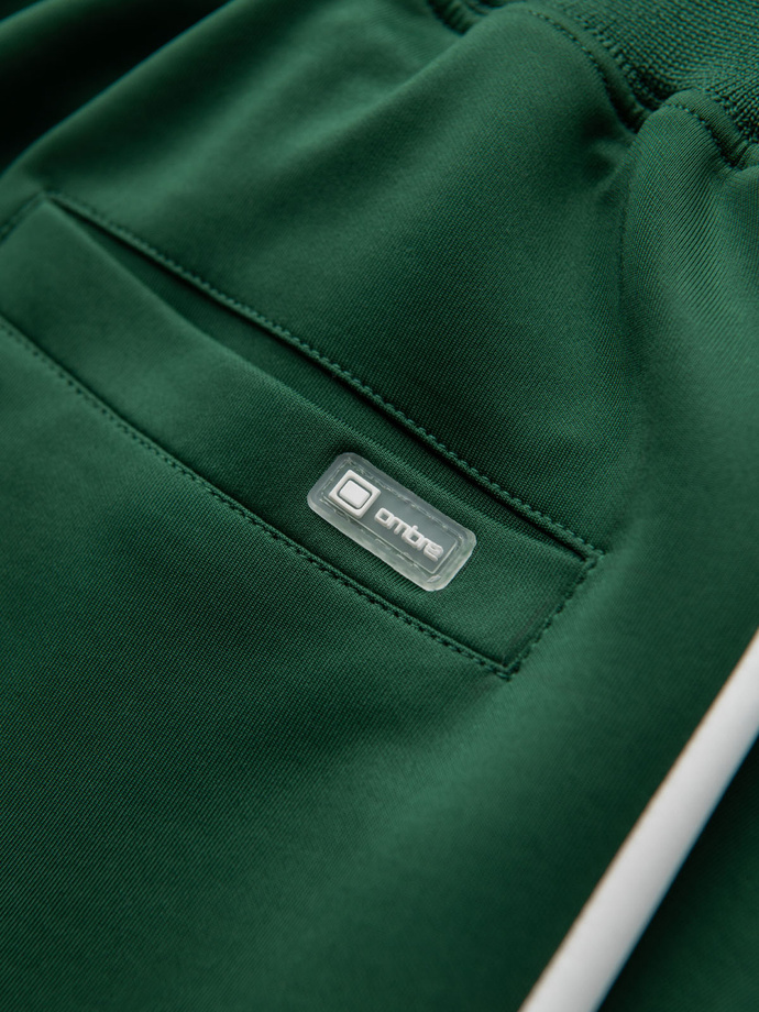 Dresowe męskie spodnie joggery z kontrastowymi lampasami – ciemnozielone V7 OM-PASK-0229