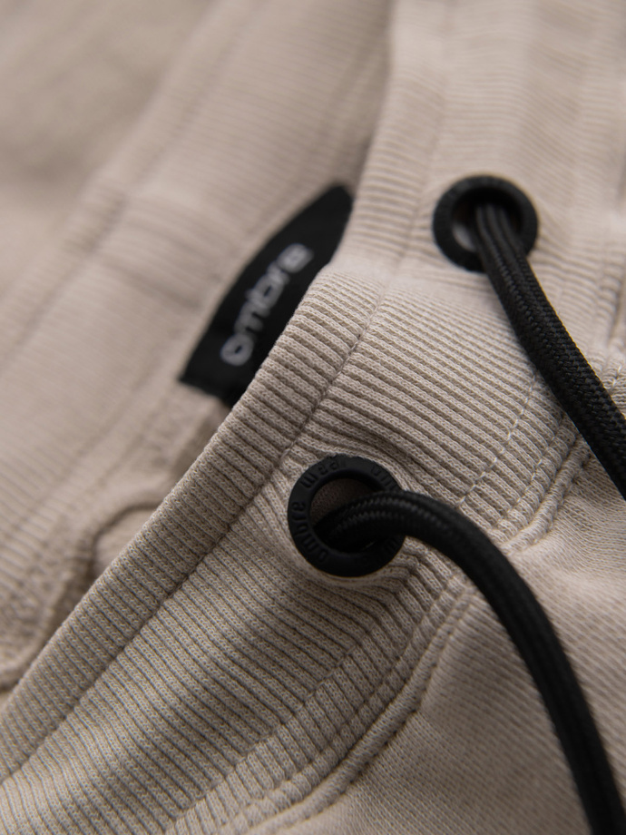 Men's short sweat shorts with wide stripes - beige V2 OM-SRSK-0182