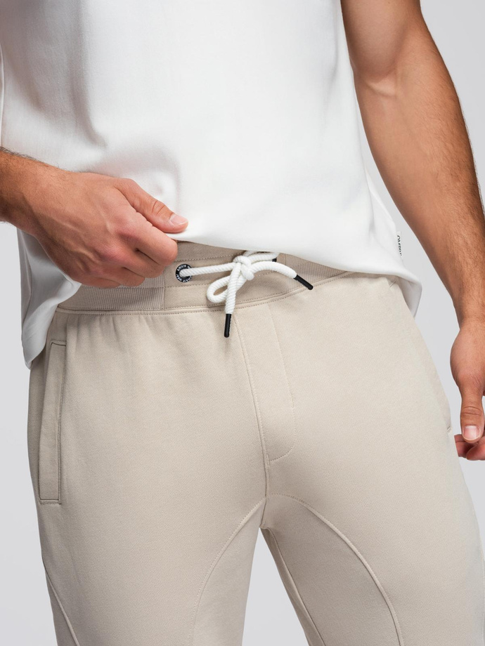 Spodnie męskie dresowe typu jogger - jasnobeżowe V1 OM-PABS-0173
