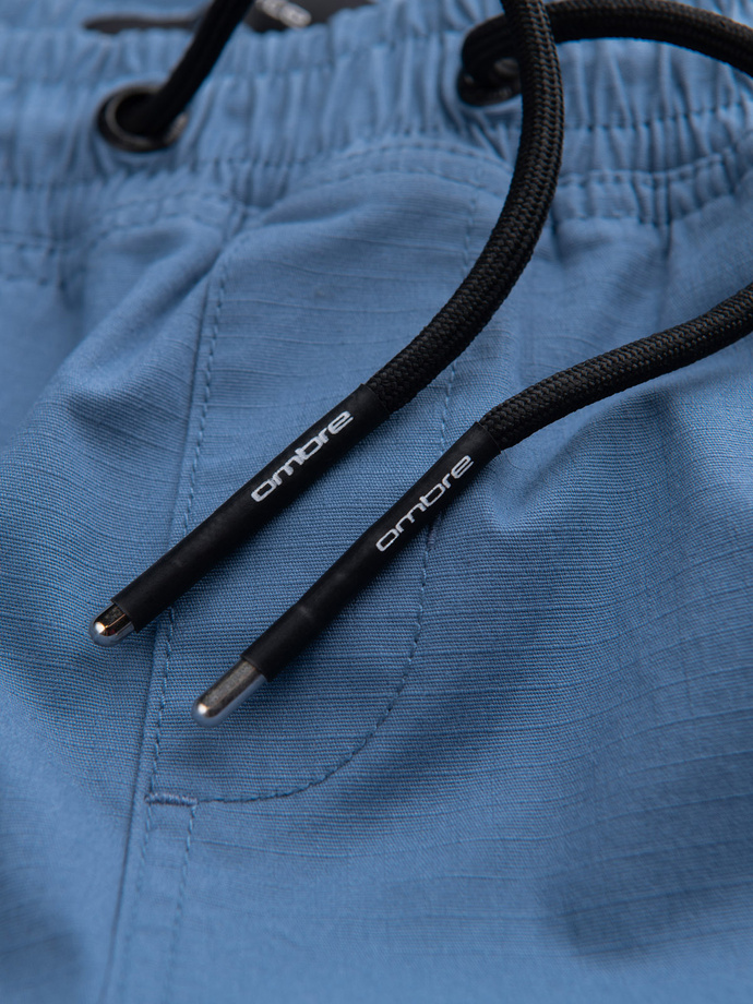 Spodnie męskie JOGGERY z odstającymi i zapinanymi kieszeniami cargo - niebieskie V7 OM-PAJO-0135