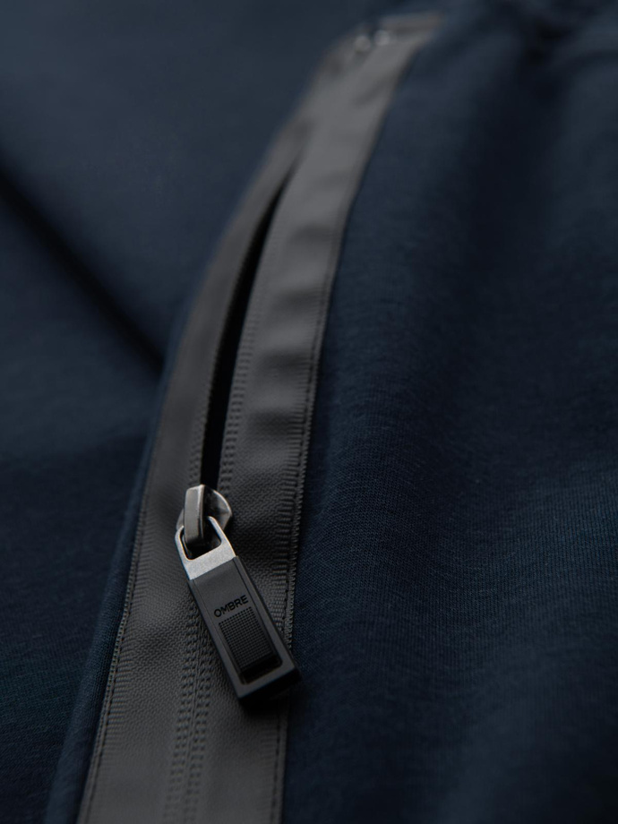 Spodnie męskie dresowe z prostą nogawką i gumowymi detalami – ciemnoniebieskie V2 OM-PASK-0281