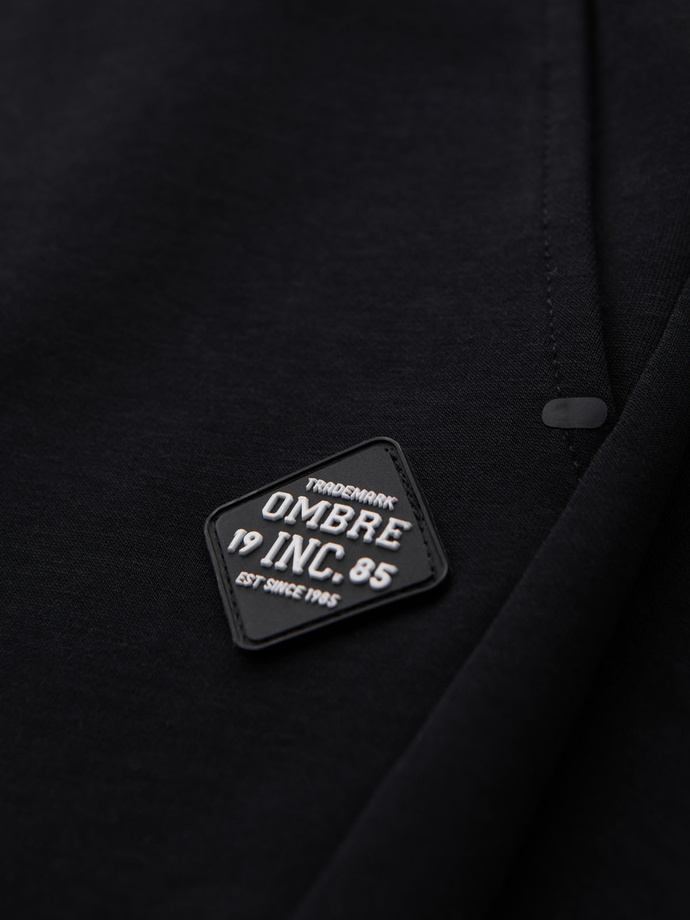 Spodnie męskie dresowe ze ściągaczami i ozdobnym zamkiem – czarne V3 OM-PASK-0226