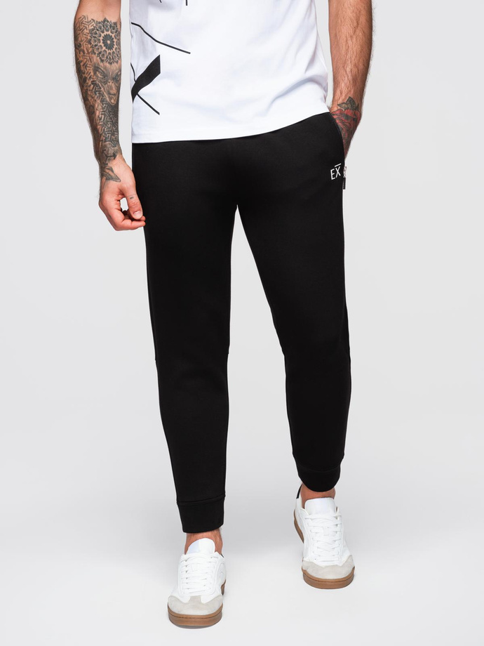 Men's sweatpants with ribbed legs and rubber print - black V1 OM-PASK-0223