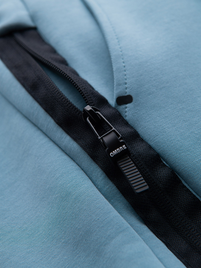 Men's sweatpants with ribbed cuffs and decorative zipper - light blue V4 OM-PASK-0226