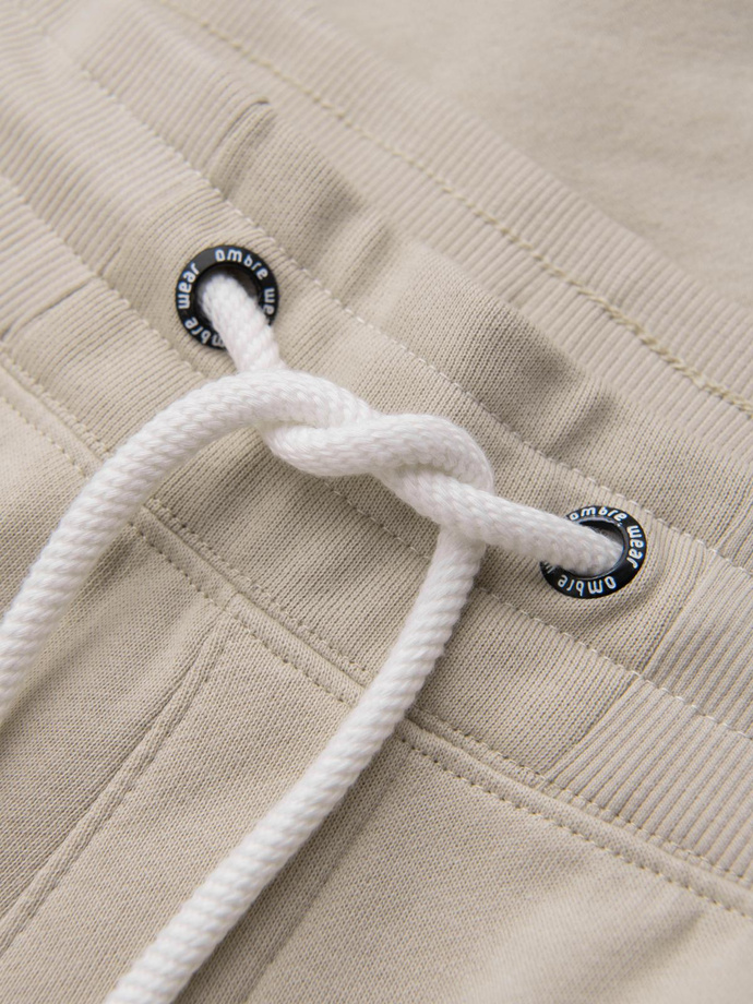 Spodnie męskie dresowe typu jogger - jasnobeżowe V1 OM-PABS-0173