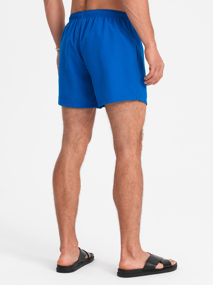 Neonowe męskie szorty kąpielowe z efektem magic print – niebieskie V3 OM-SRBS-0147