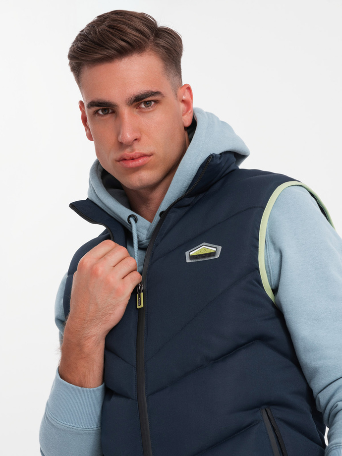 Men's quilted sleeveless jacket with neon accents - navy blue V3 OM-JAVJ-0210